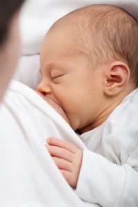 baby being breast fed by mother